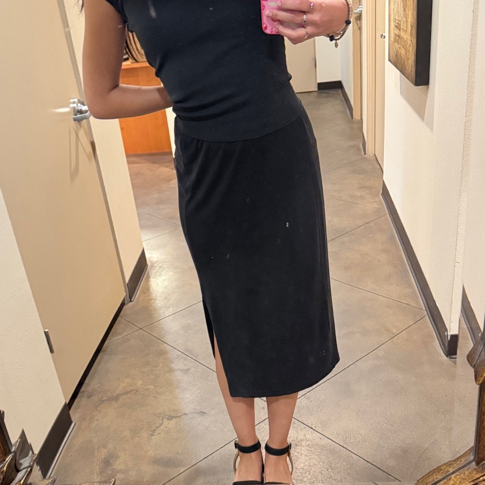 Truth size small black skirt with slit in the side super flattering and comfy.